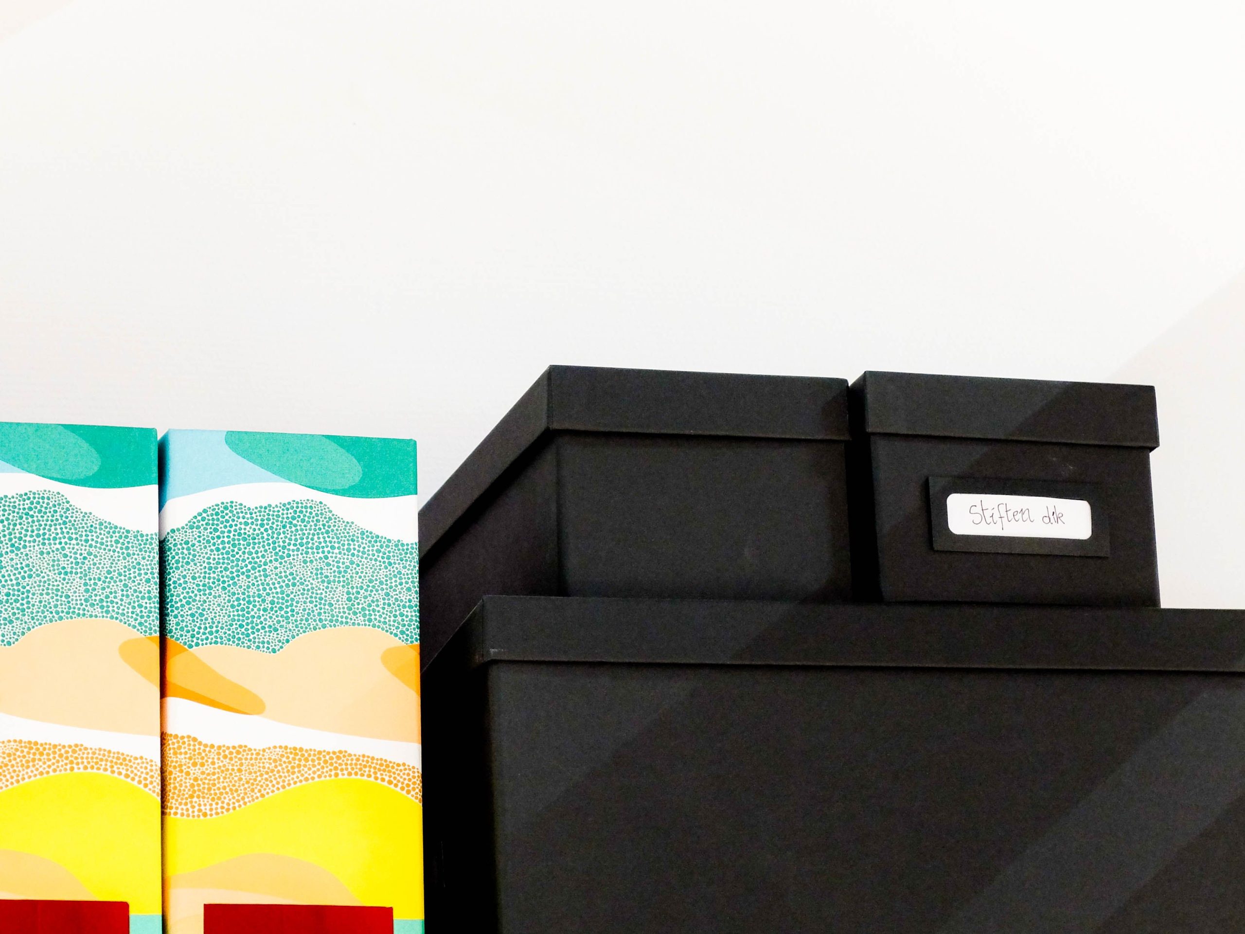 organized closet with labeled storage boxes