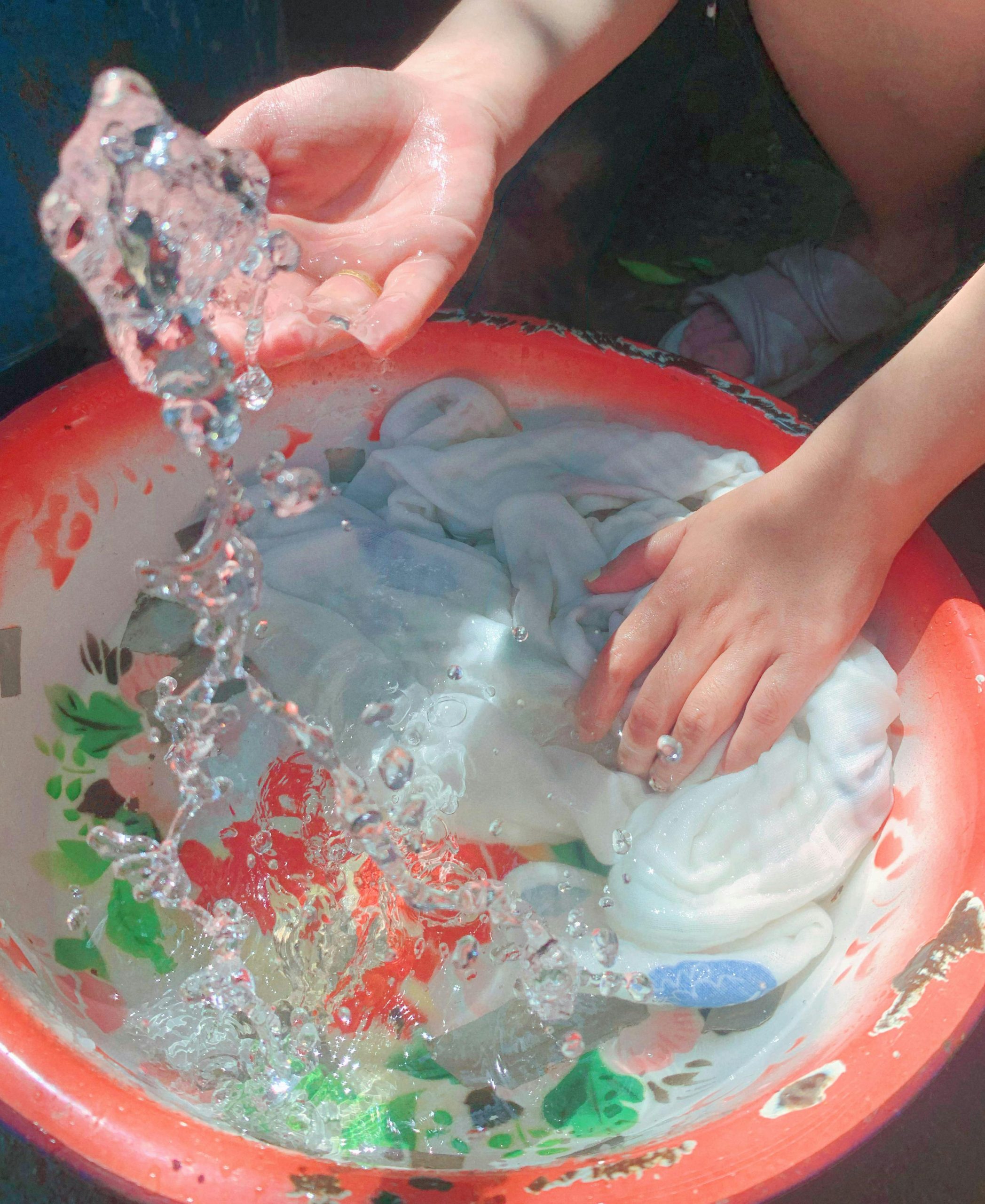 hand washing down jacket in basin