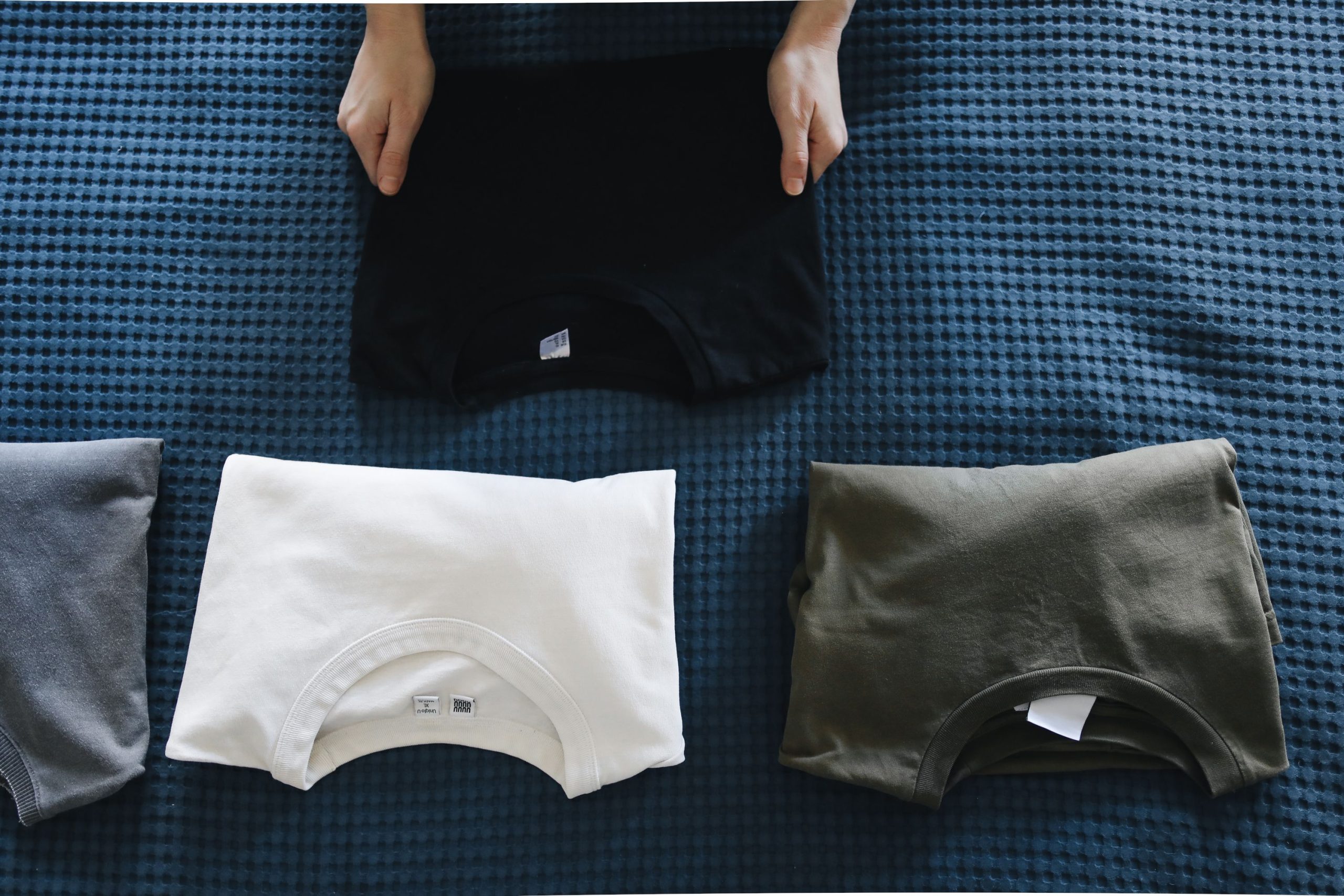 folded t-shirts in drawer standing upright