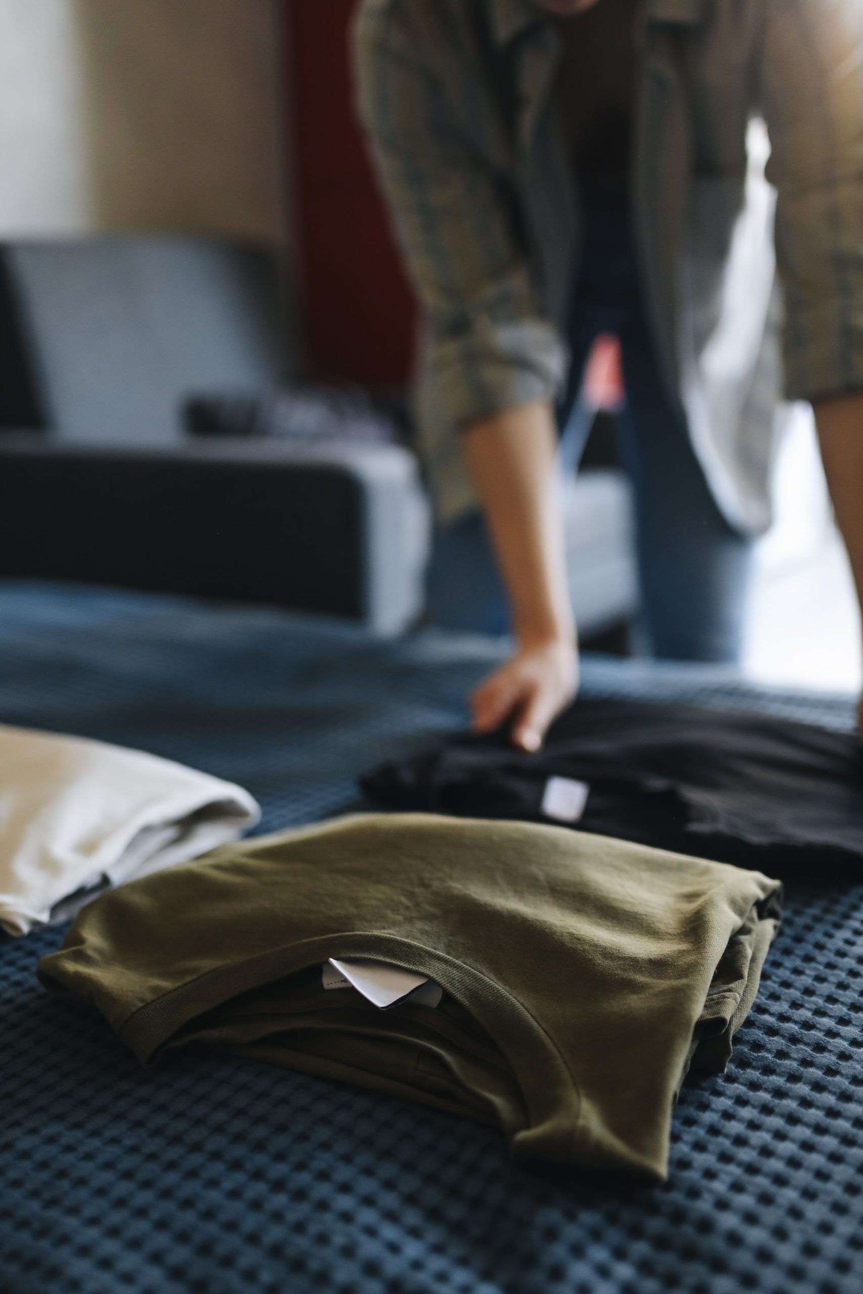 clothes sorted on bed categories
