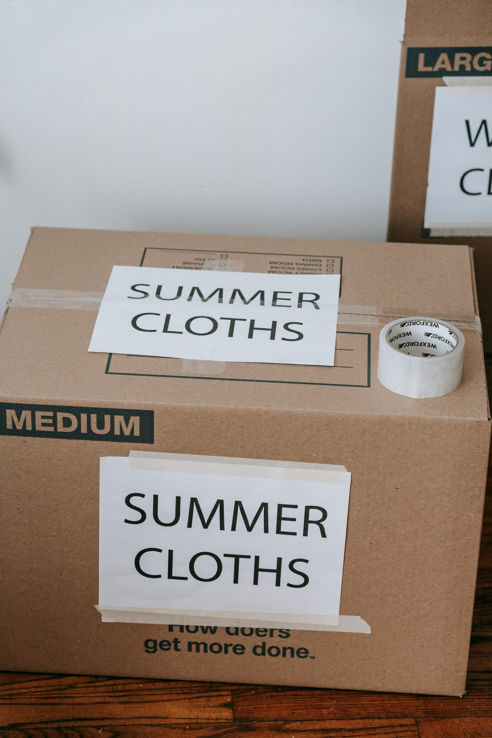 labeled storage boxes seasonal clothes